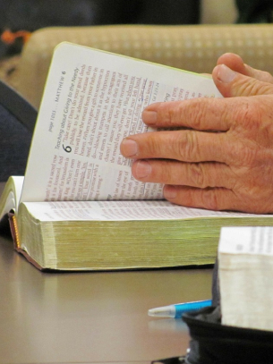 a person reading a bible