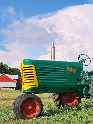 Tractor with a barn in the background
