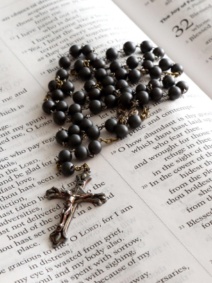 rosary on a bible